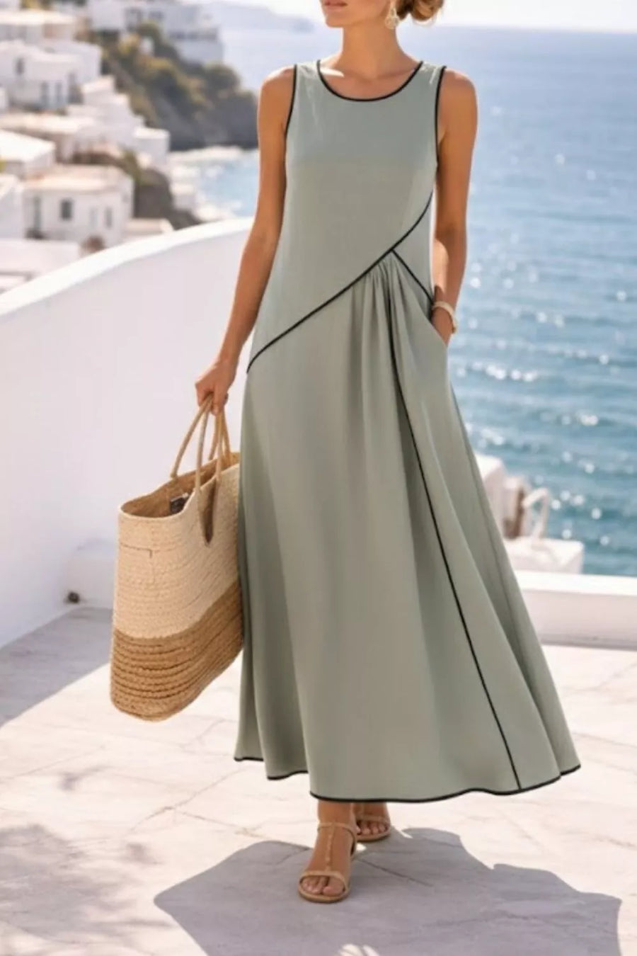 Sage maxi dress with contrast black piping and asymmetric detailing.