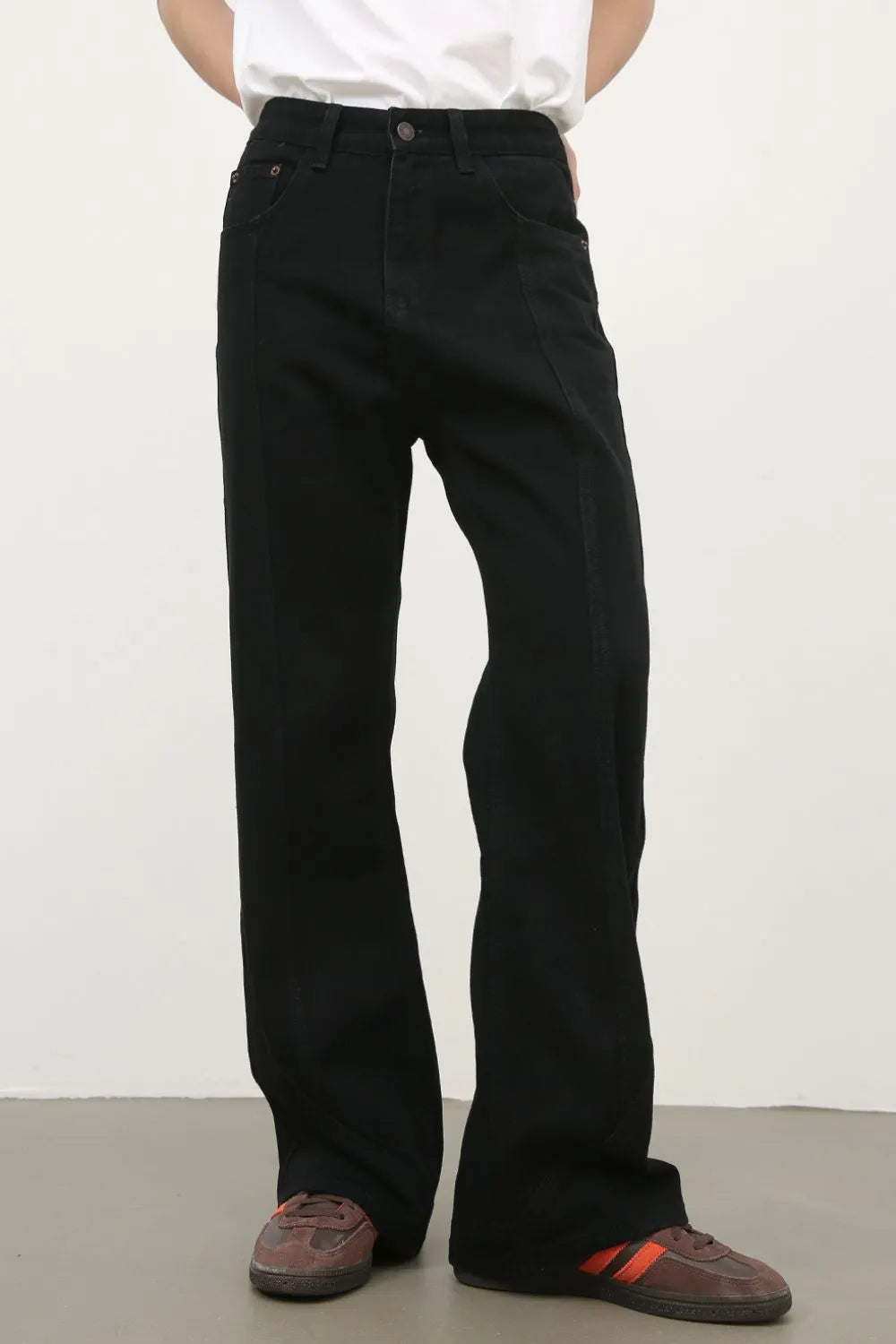 Black flare jeans with panel seams and a casual fit.