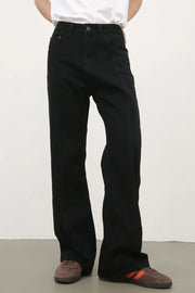 Black flare jeans with panel seams and a casual fit.