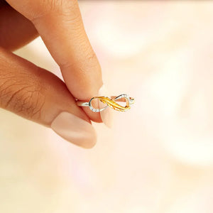 Infinity feather sterling ring in gold with diamond accents