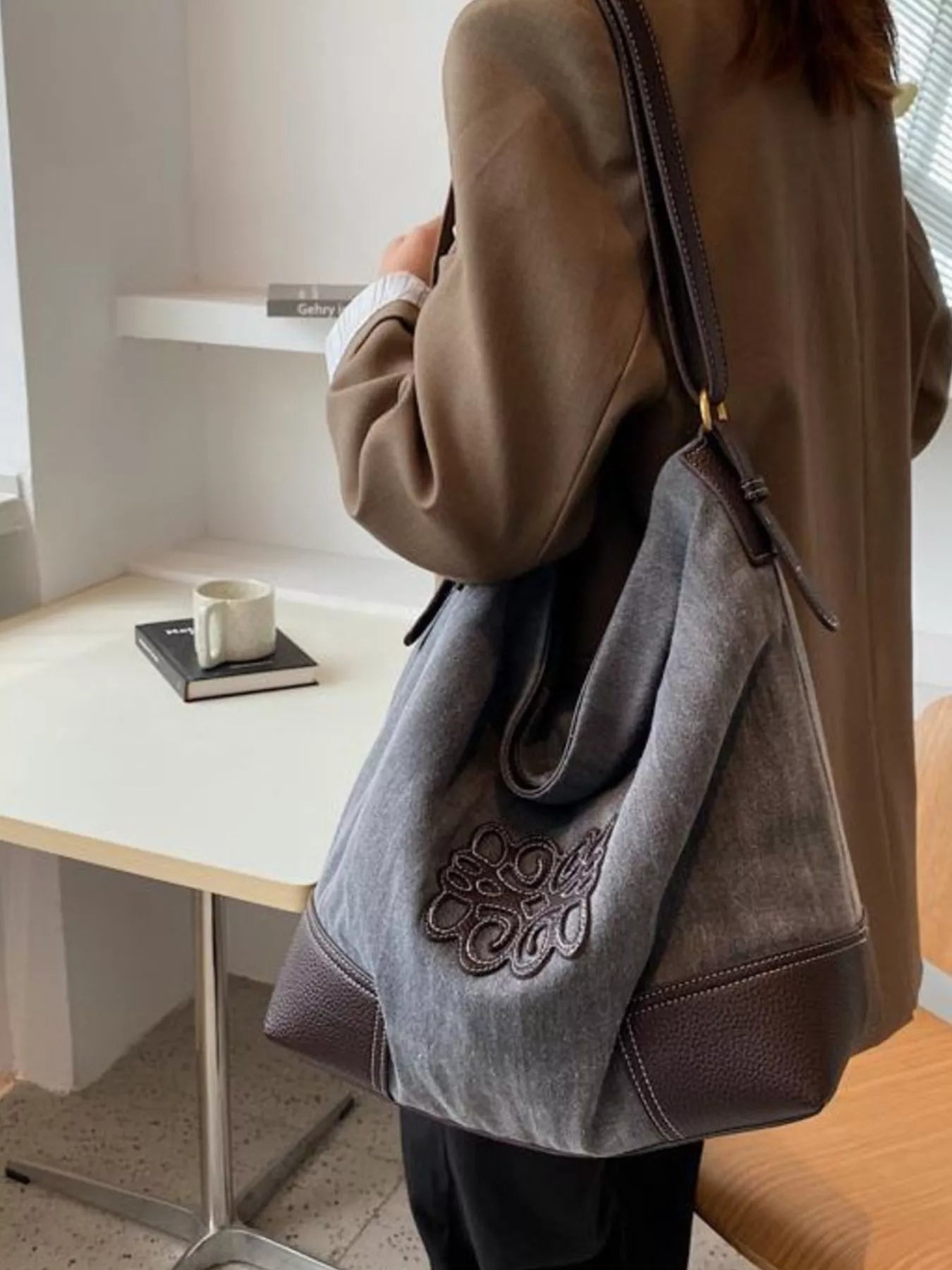 Medium canvas tote bag in blue with embroidered detail and brown leather trim