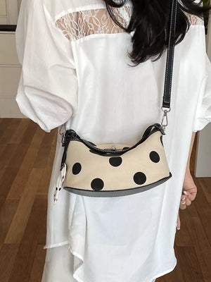 Black shoulder bag with turn-lock and polka-dot