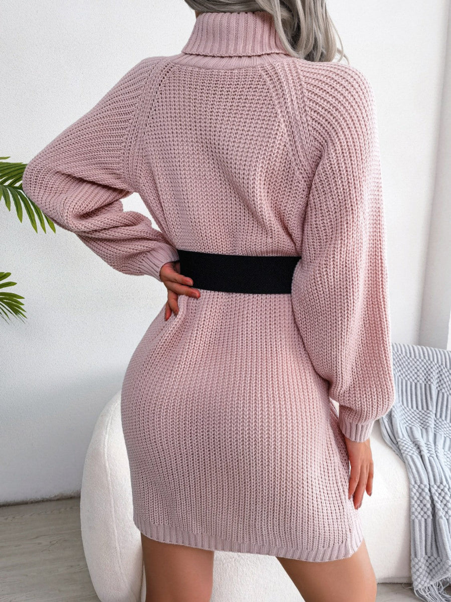 Dusty pink ribbed knit turtleneck sweater dress with balloon sleeves and a black belt.