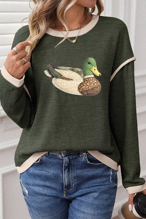 cream pullover sweater featuring contrast trim and graphic print