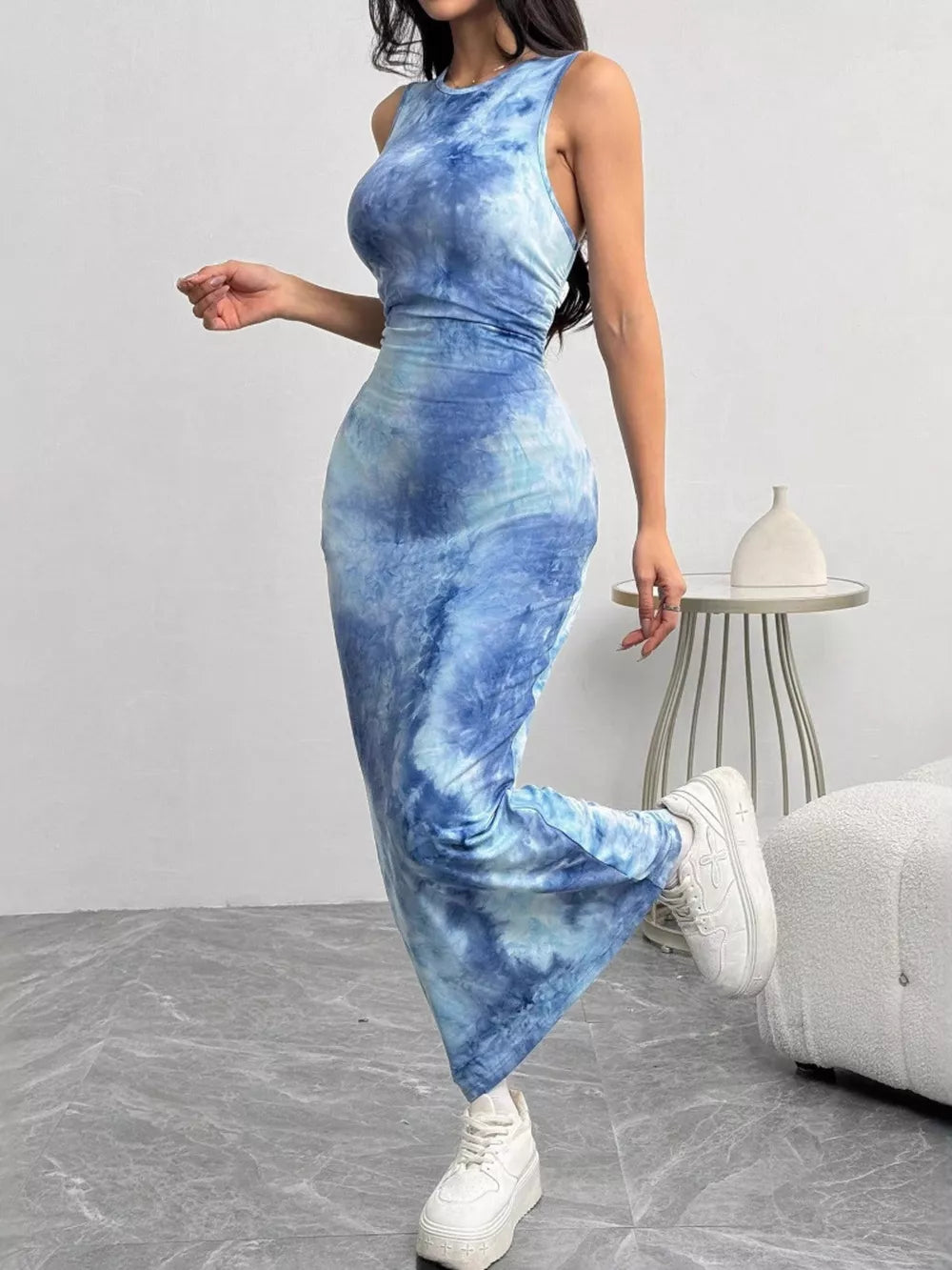 Vibrant sea blue tie-dye maxi dress with a round neckline and sleeveless design.