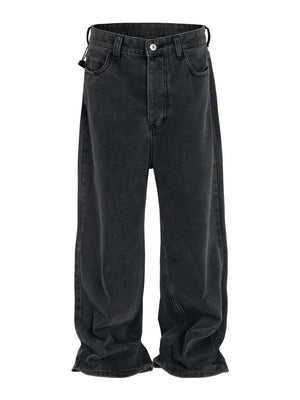 Baggy dark wash denim jeans with a sculpted hemline and relaxed fit.