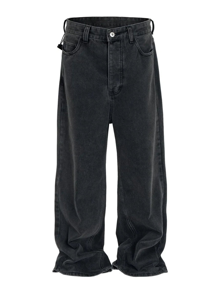 Baggy dark wash denim jeans with a sculpted hemline and relaxed fit.