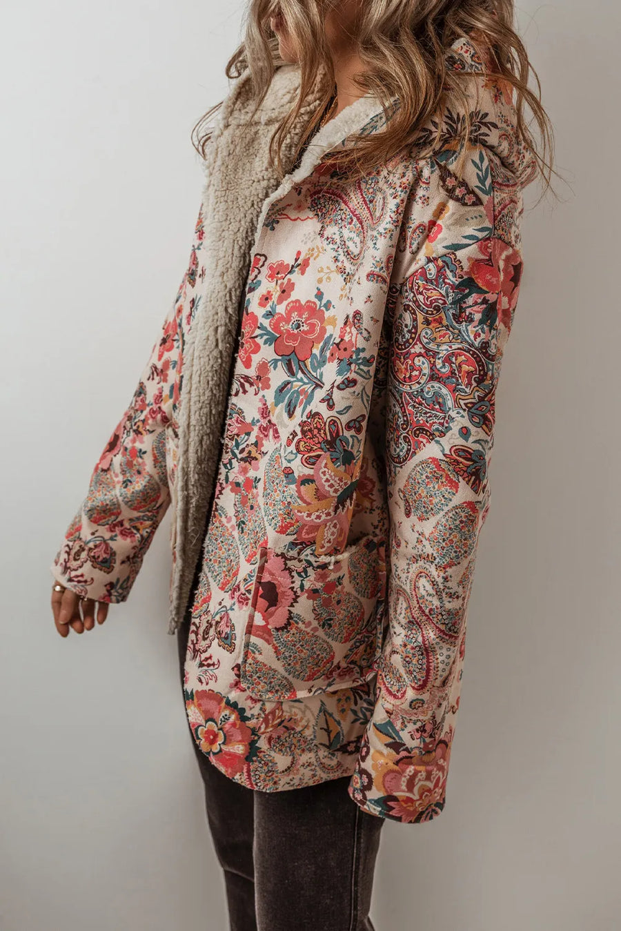 Floral paisley hooded jacket with sherpa lining and pockets.
