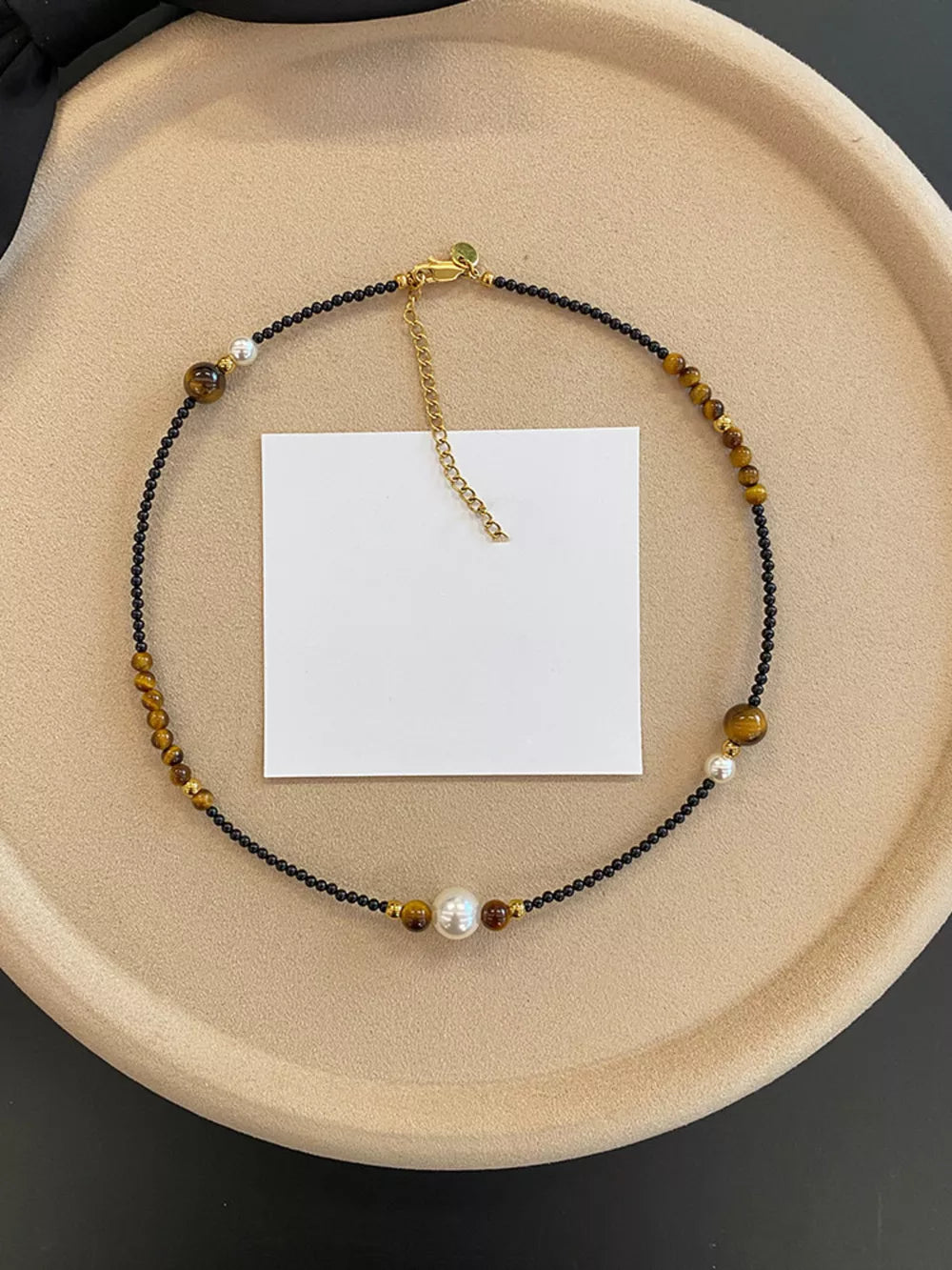 Elegant Tiger Eye Layered Necklace with pearl accents and gold chain clasp