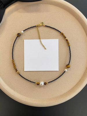 Elegant Tiger Eye Layered Necklace with pearl accents and gold chain clasp