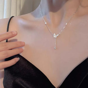 necklace in clear with butterfly pendant and princess