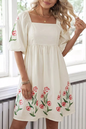 Cream floral puff sleeve A-line dress with square neckline and pockets.