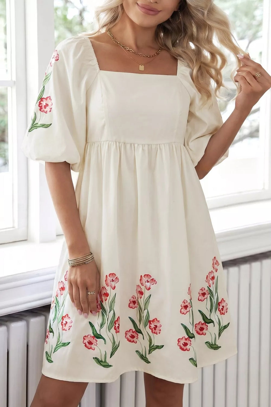 Cream floral puff sleeve A-line dress with square neckline and pockets.