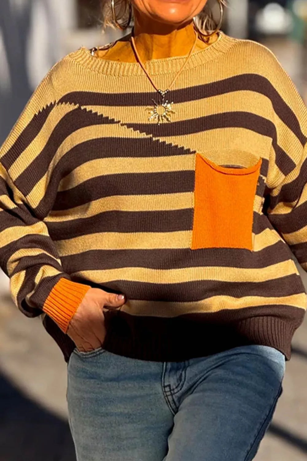 55% acrylic, 45% cotton Care instructions: Machine wash cold pullover sweater in Gold with relaxed silhouette