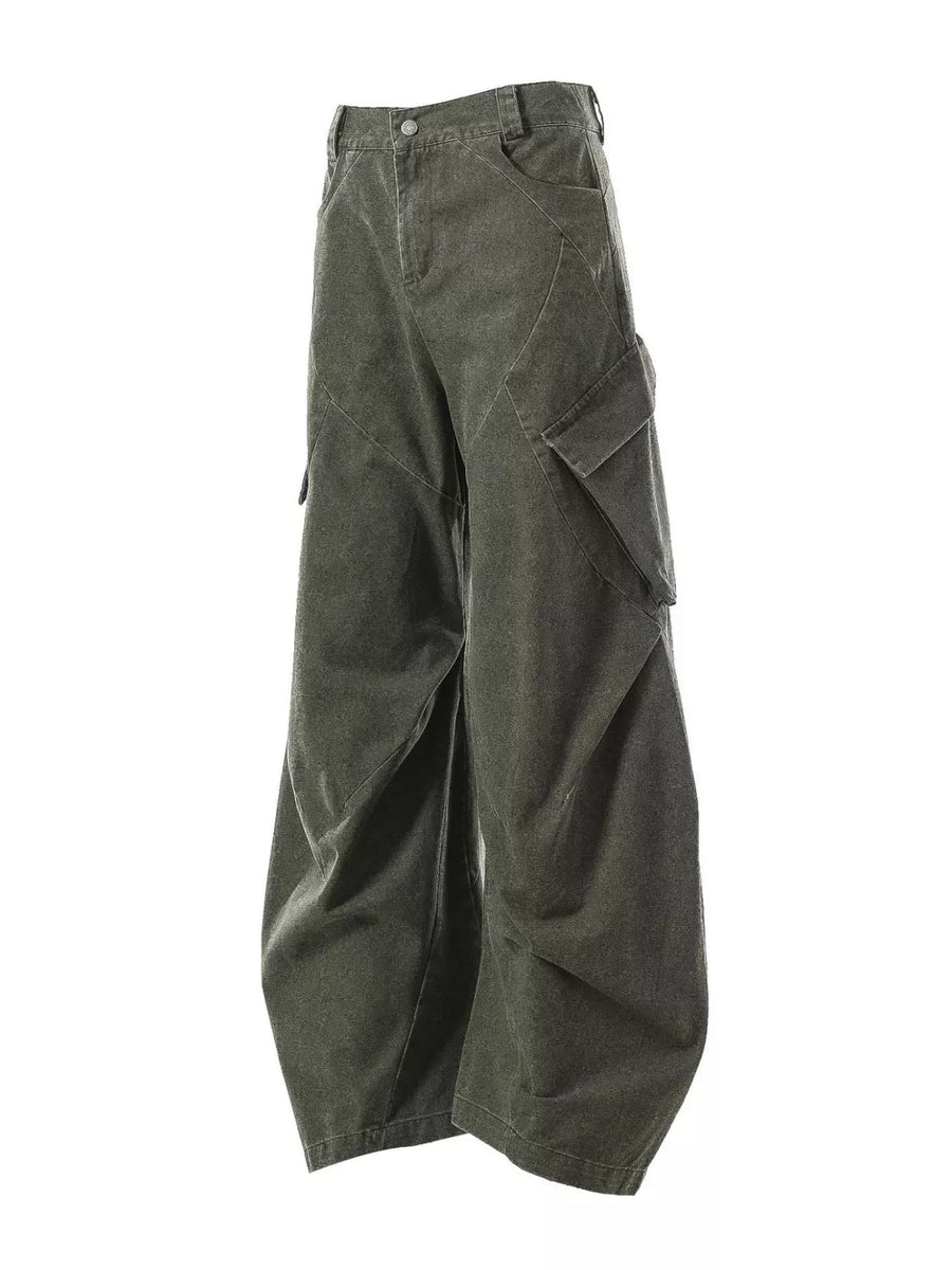 Textured paneled cargo pants in army green with a baggy fit and multiple pockets.
