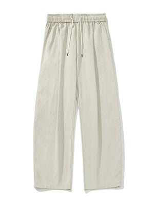Balloon-fit drawstring trousers in taupe with a casual, wide-leg cut.