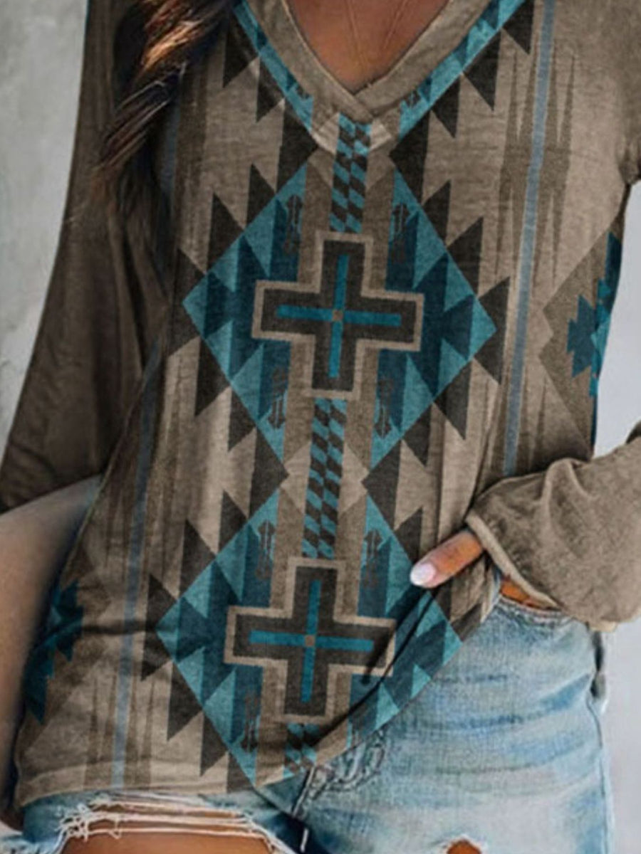Geometric V-neck long sleeve t-shirt in grey with a colorful tribal pattern and cross motif.