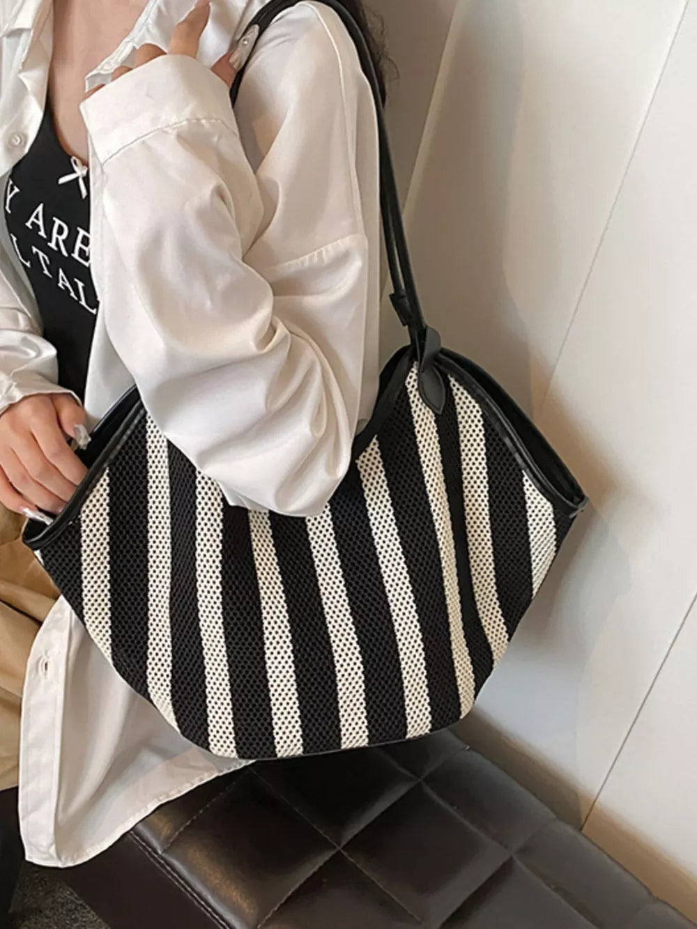 handbag featuring striped in Black with Polyester Imported Size &amp texture