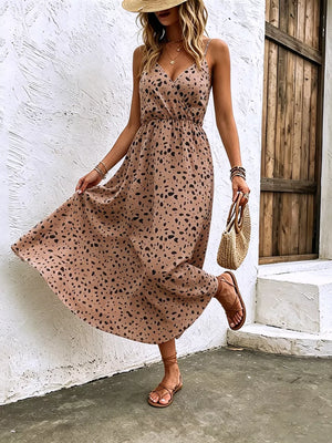 Taupe floral print spaghetti strap midi dress with adjustable straps and a-line cut.