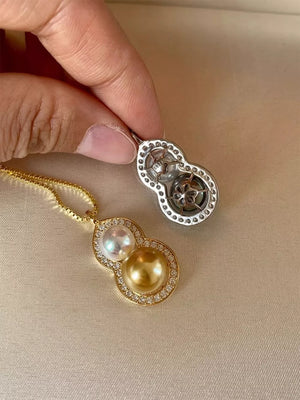 Gold gourd pendant necklace with pearls and cubic zirconia on a box chain.