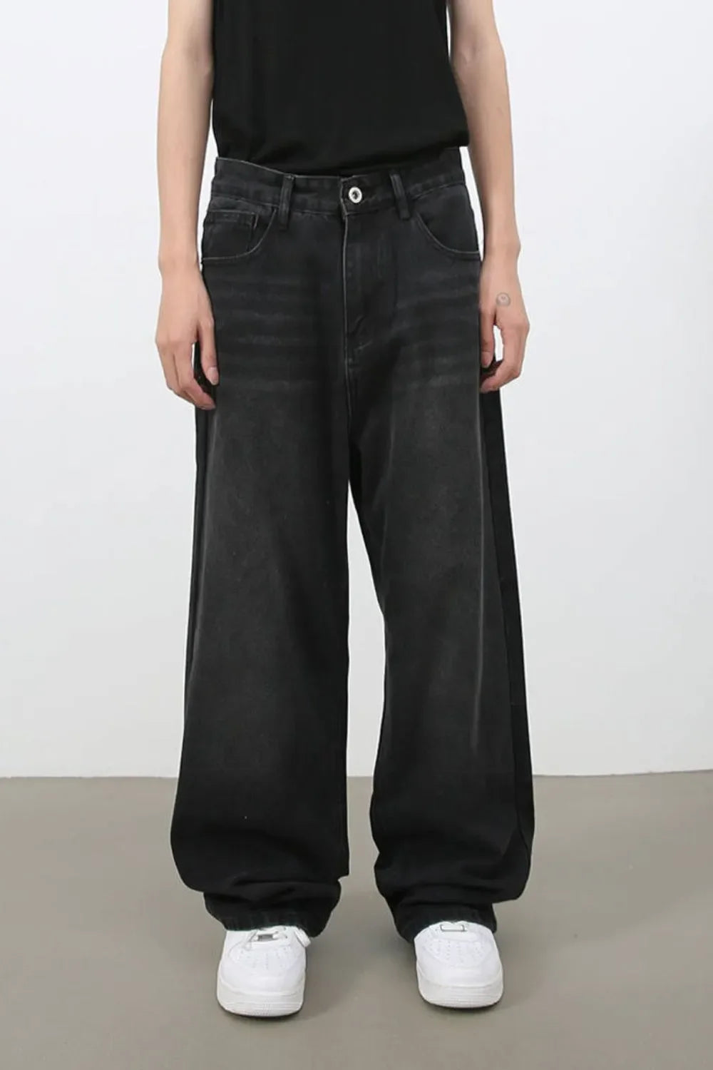 Black wide leg denim jeans with a casual, relaxed fit.