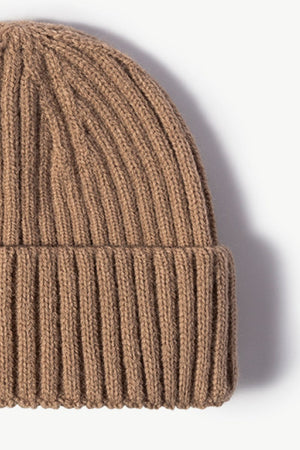 Chunky ribbed knit beanie in brown acrylic with a cuffed hem.