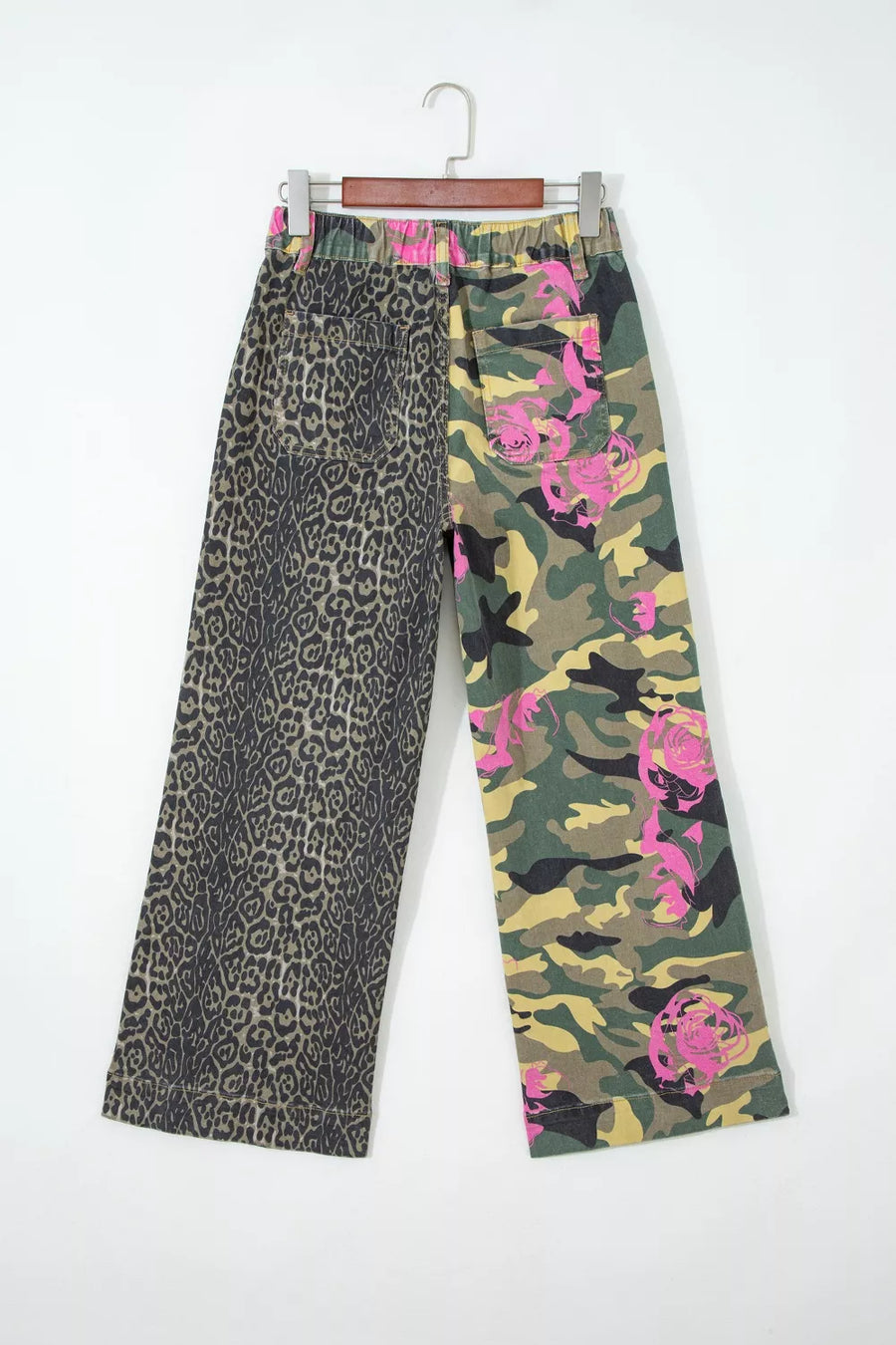 Contrast patchwork jeans with leopard print and pink floral camo design.