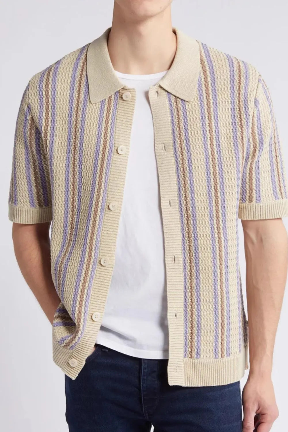 Textured knit polo shirt in tan with purple and brown stripes, short sleeves, and button front.