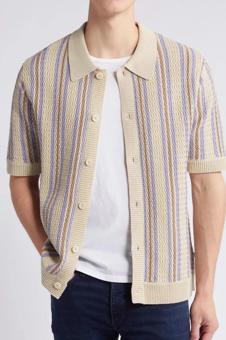 Textured knit polo shirt in tan with purple and brown stripes, short sleeves, and button front.