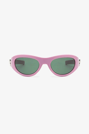 Dusty pink sporty shield sunglasses with green lenses and a bow accent.