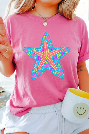 Pink cotton t-shirt with a blue starfish graphic filled with colorful flowers.