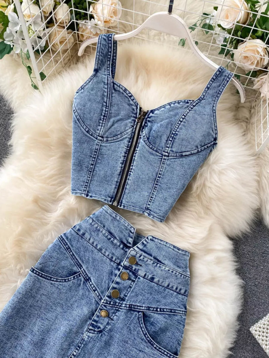 Chic acid wash denim two-piece set with bustier crop top and button-front skirt.