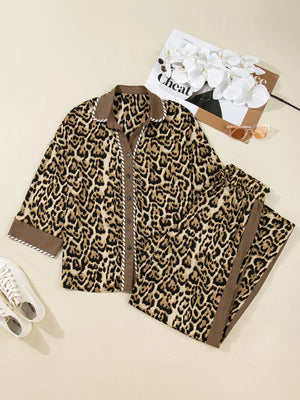 Leopard print two-piece set with buttoned shirt and pants, featuring contrast trim and collar.