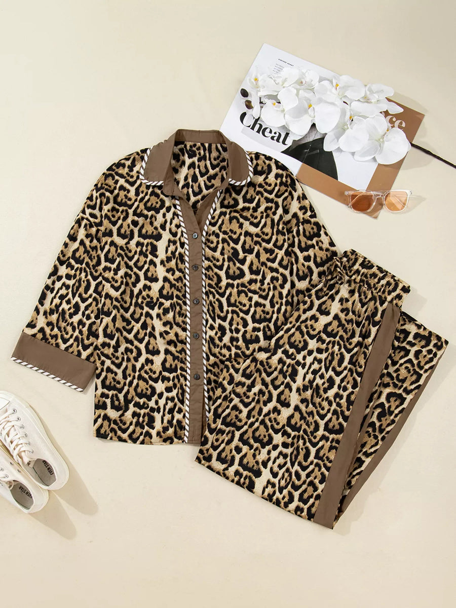 Leopard print two-piece set with buttoned shirt and pants, featuring contrast trim and collar.