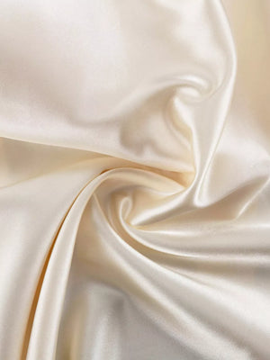 Cream satin fabric with a smooth, lustrous finish and soft drape.