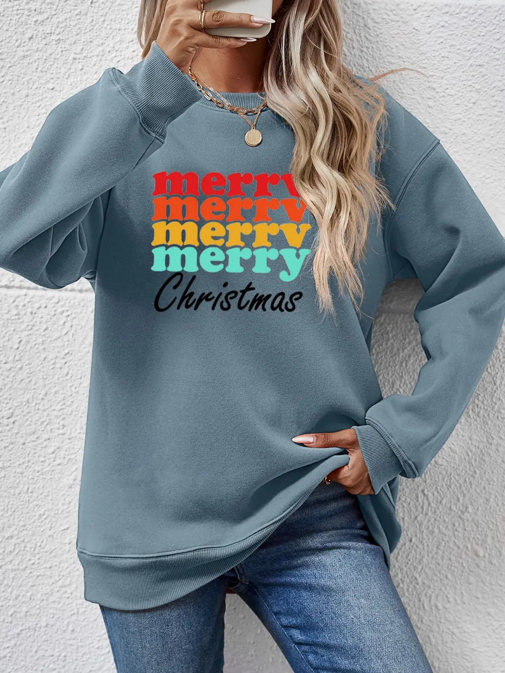 Light Blue retro Christmas graphic sweatshirt with stacked colorful "merry" text and "Christmas" below.