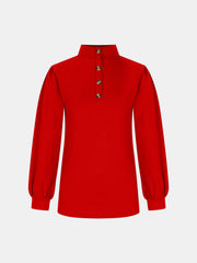 Red button-back mock neck top with puff sleeves and a textured knit.