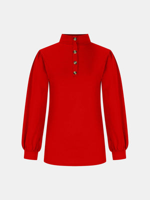 Red button-back mock neck top with puff sleeves and a textured knit.
