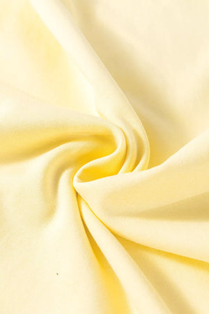 Light yellow cotton knit fabric with soft folds.