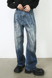 Faded ombre wide-leg jeans in medium blue denim with a relaxed fit.