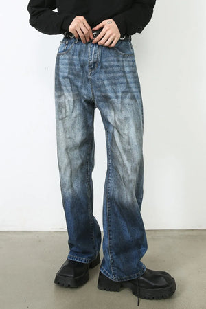 Faded ombre wide-leg jeans in medium blue denim with a relaxed fit.