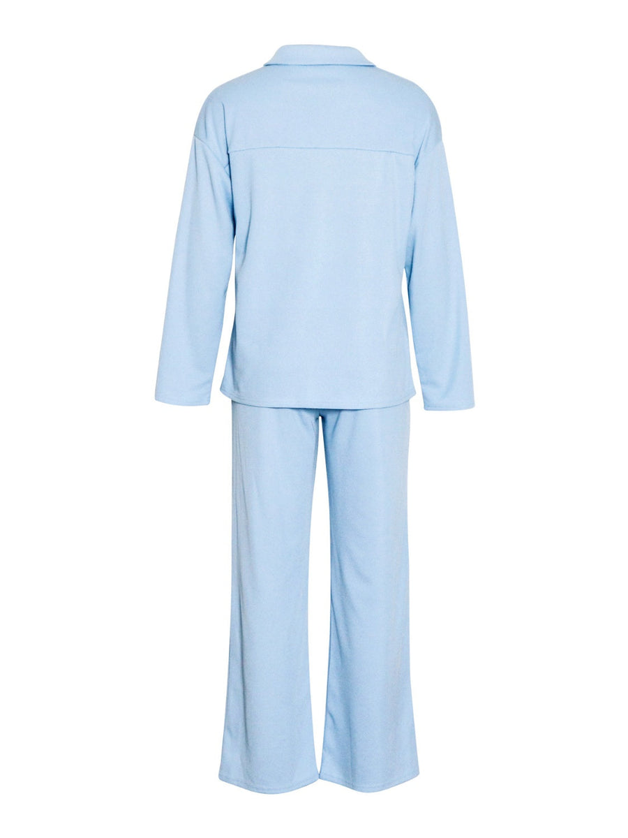 Light blue ribbed knit lounge set with relaxed fit long sleeve top and wide leg pants.