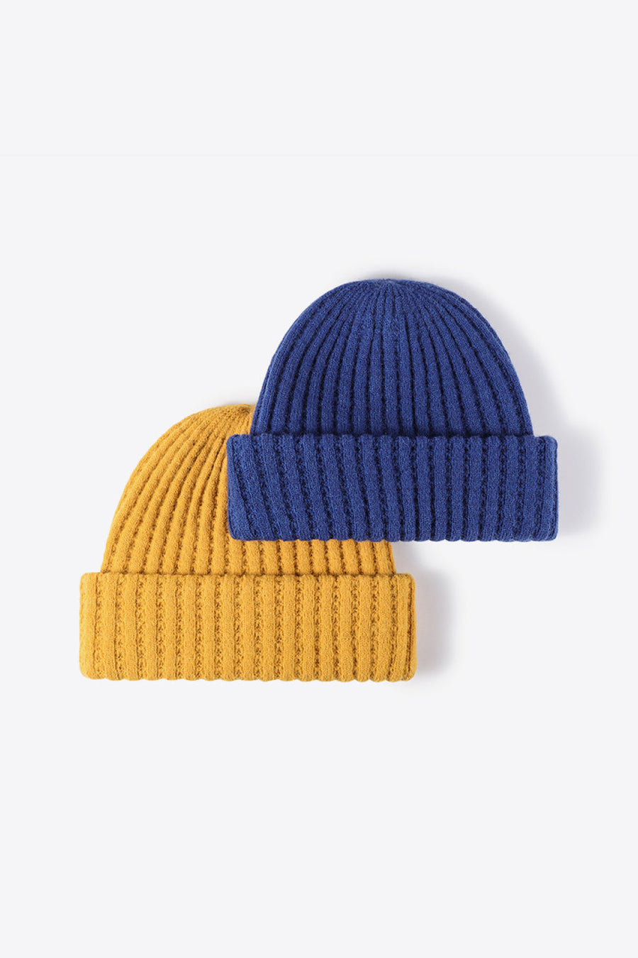 Textured ribbed knit beanies in mustard and indigo acrylic