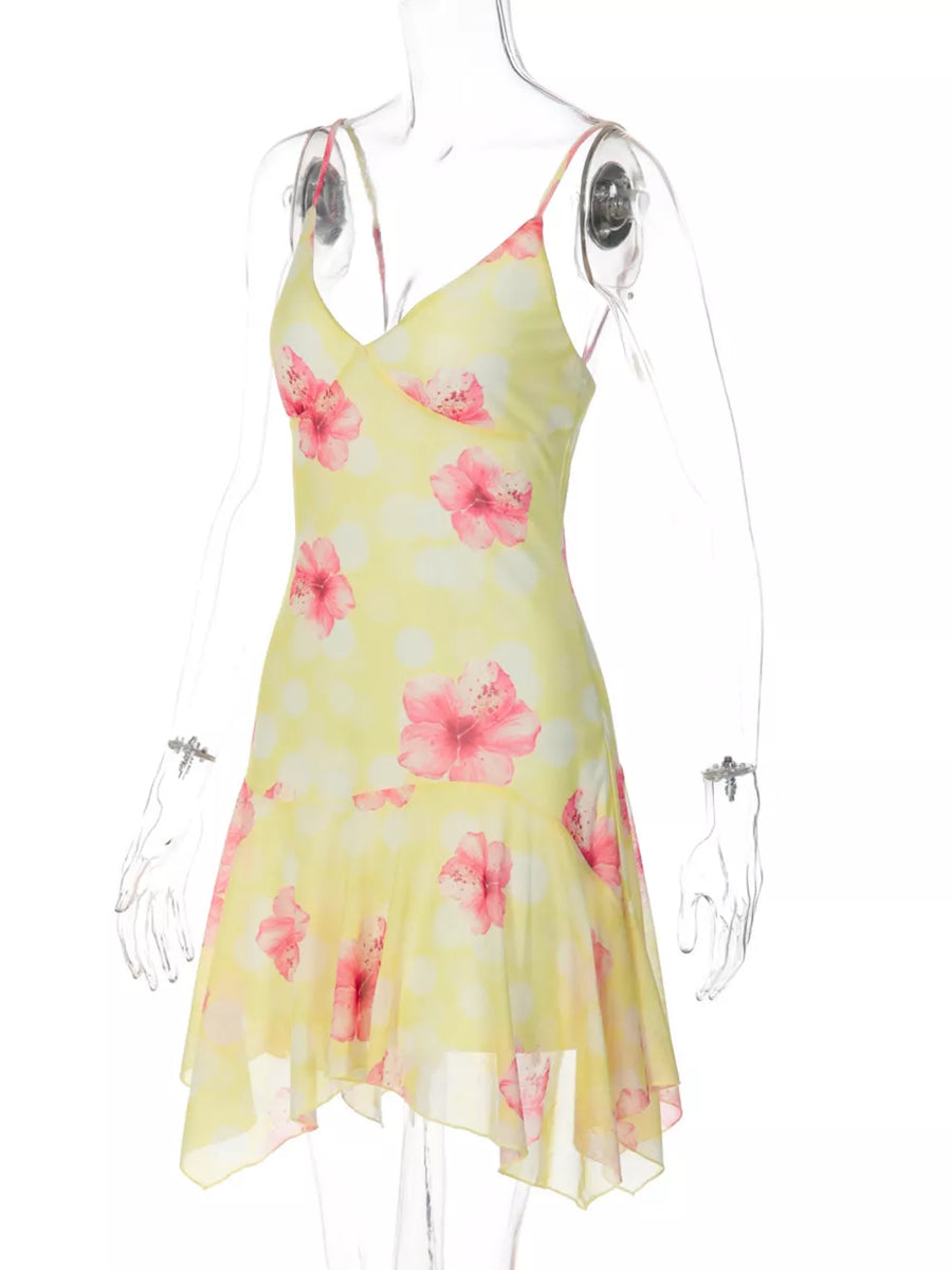 Yellow floral asymmetrical mini dress with ruffled hem and polka dots