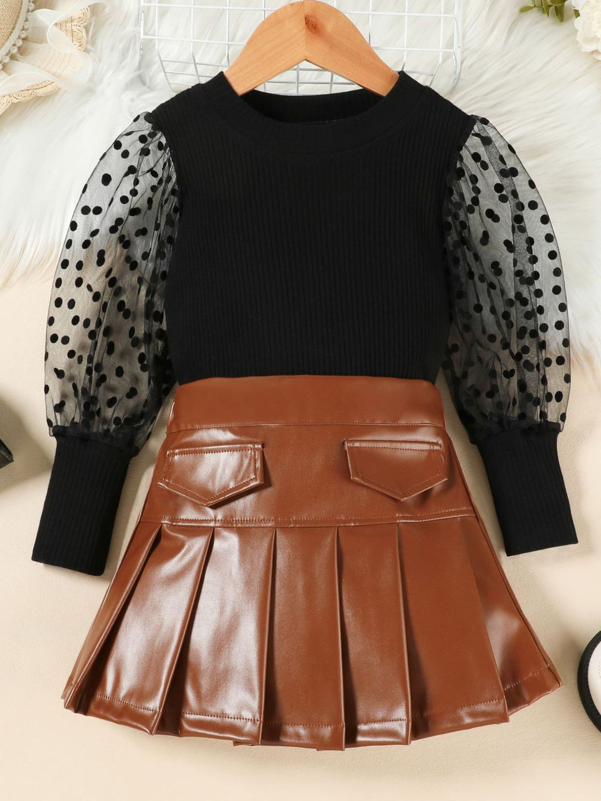 Black polka dot sleeve top and brown faux leather pleated skirt set for toddlers.