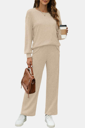 Tan ribbed knit lounge set with crew neck sweater and wide leg pants.