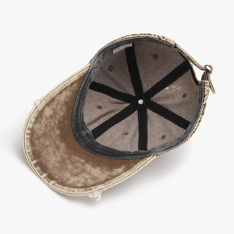 Tan acid wash distressed baseball cap with adjustable strap and inner lining details.