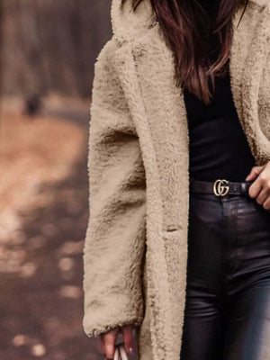 Luxurious teddy bear longline coat in camel with a hooded neckline and buttoned front.