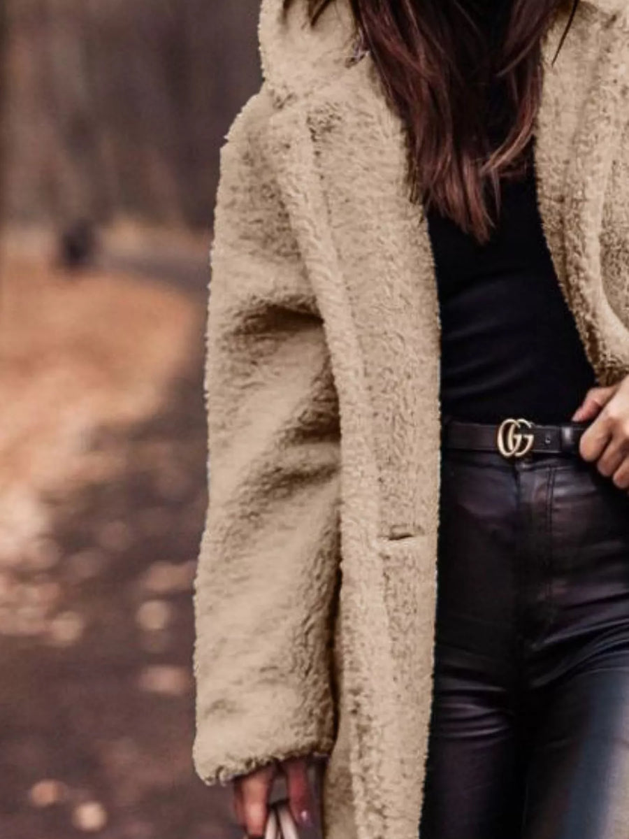 Luxurious teddy bear longline coat in camel with a hooded neckline and buttoned front.
