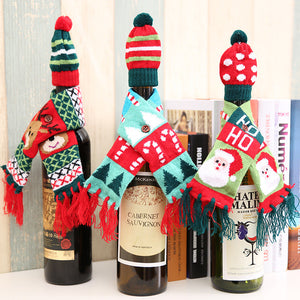 Holiday knit bottle cosies with Santa, reindeer, and candy cane designs.